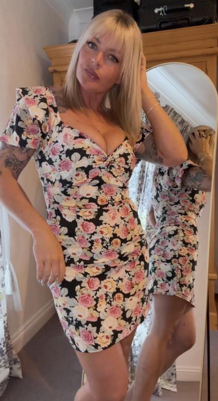 Blonde Lola Eastkings poses next to a mirror in her bedroom