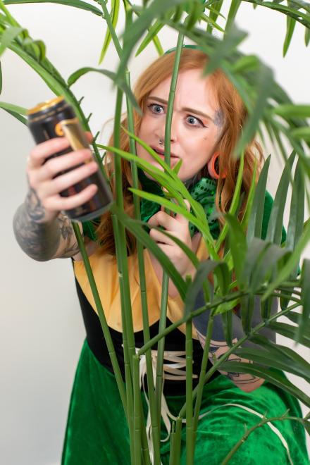Azura Ali in a bush with a guinness