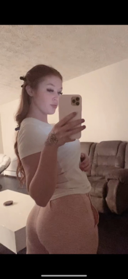 American babe in tight trousers selfie