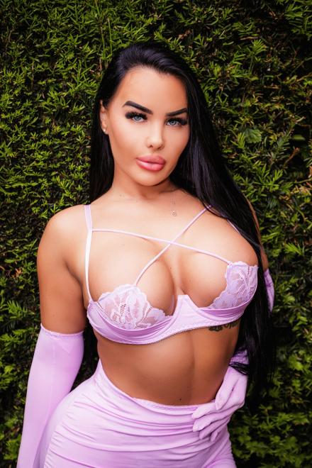 Layla Rose wearing a barely there bra