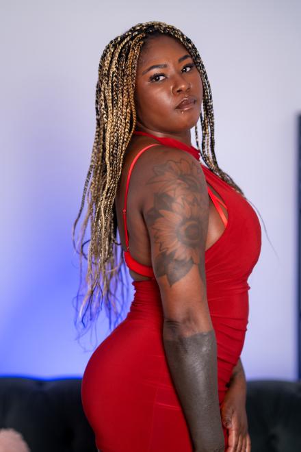 Xeinna Rose wears a tight red dress with her long blonde braids and Xeinna Rose wears a tight red dress with her long blonde braids and
