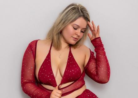 Blonde British pornstar Delilah Jynx wears red for Valentine's Day at Babestation TV