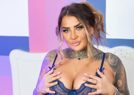 Karolina Francesca touching her breasts